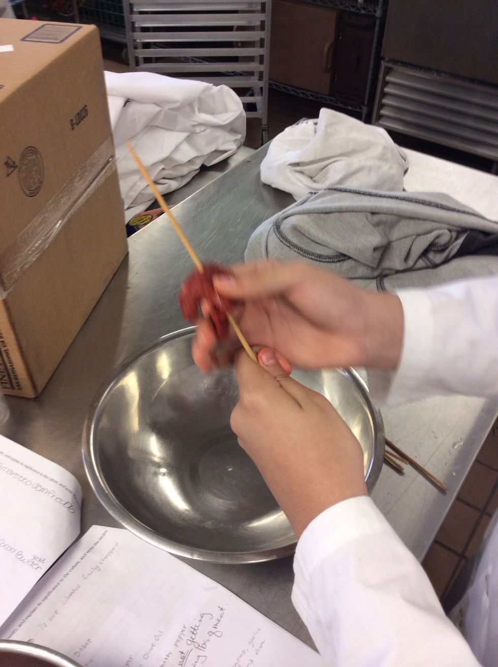 Put stick through your meat strips