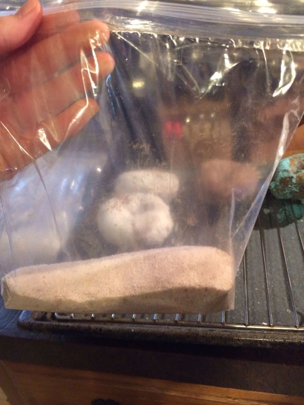 Put sugar and cinnamon in a baggie mixed well.
