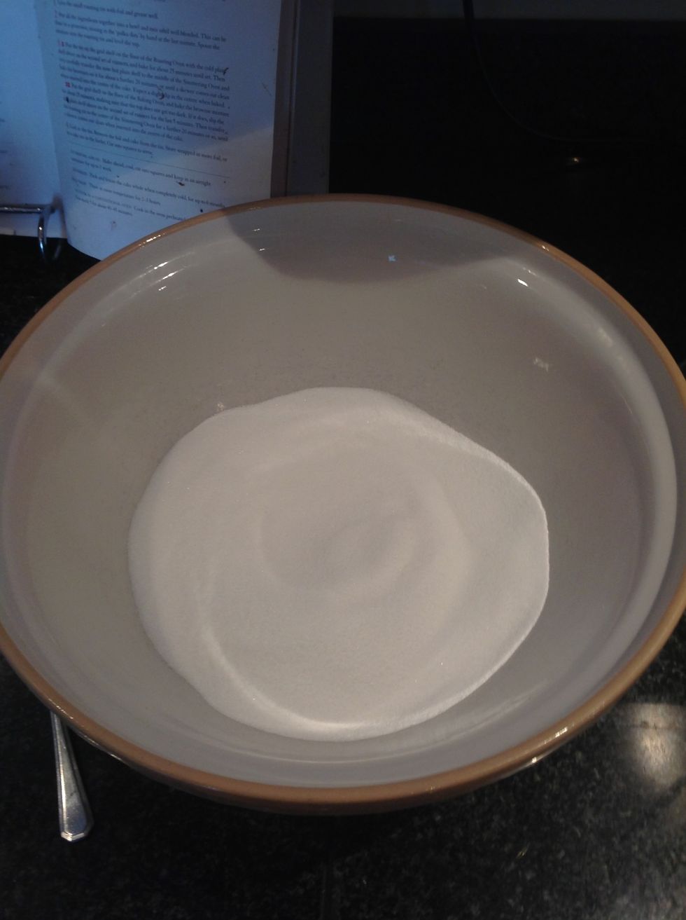 Put sugar in a large bowl... And preheat the oven ...