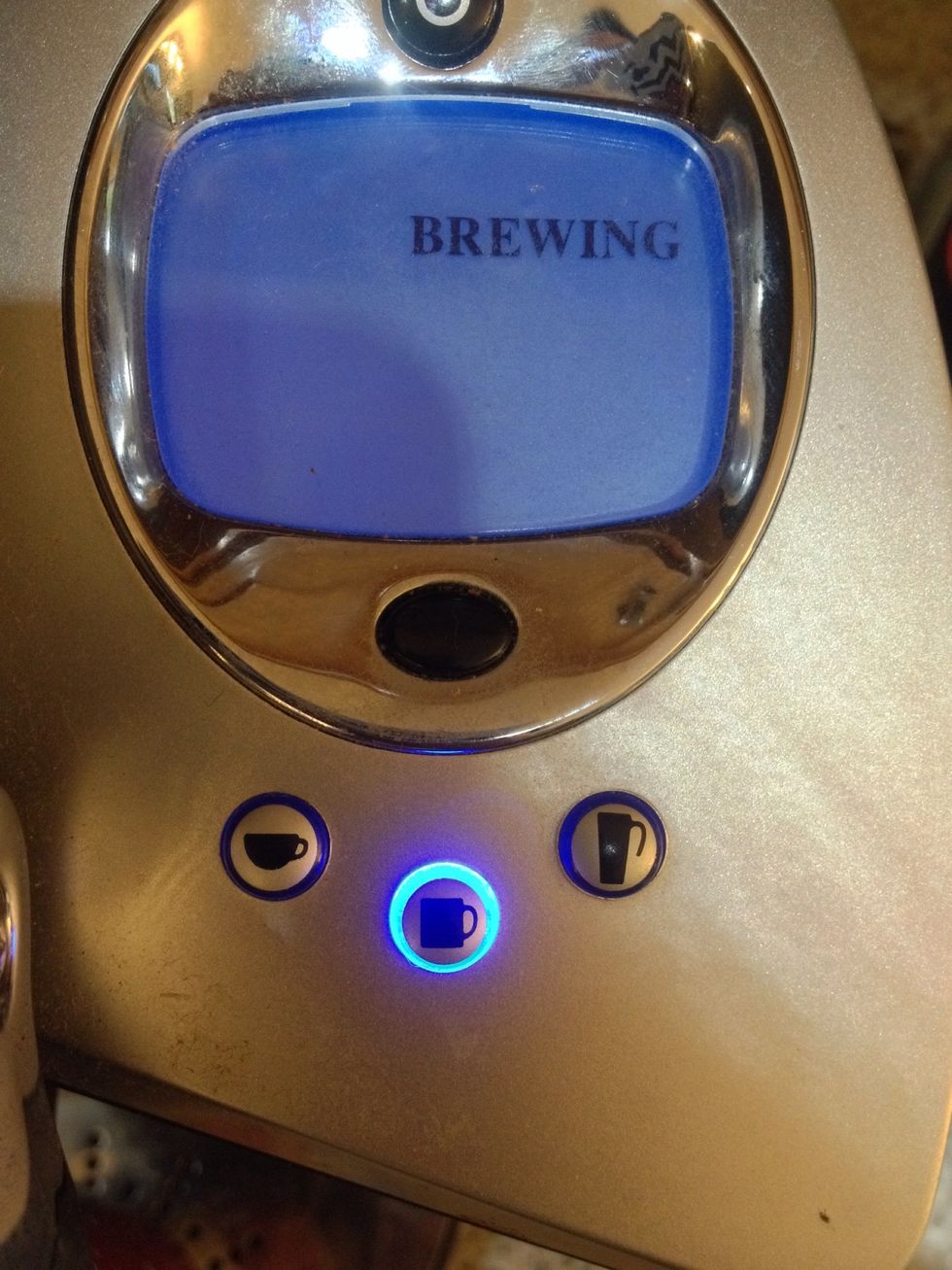 Put sugar to taste in the bottom  of your tall coffee cup. Using your keurig coffee maker, select the medium cup setting