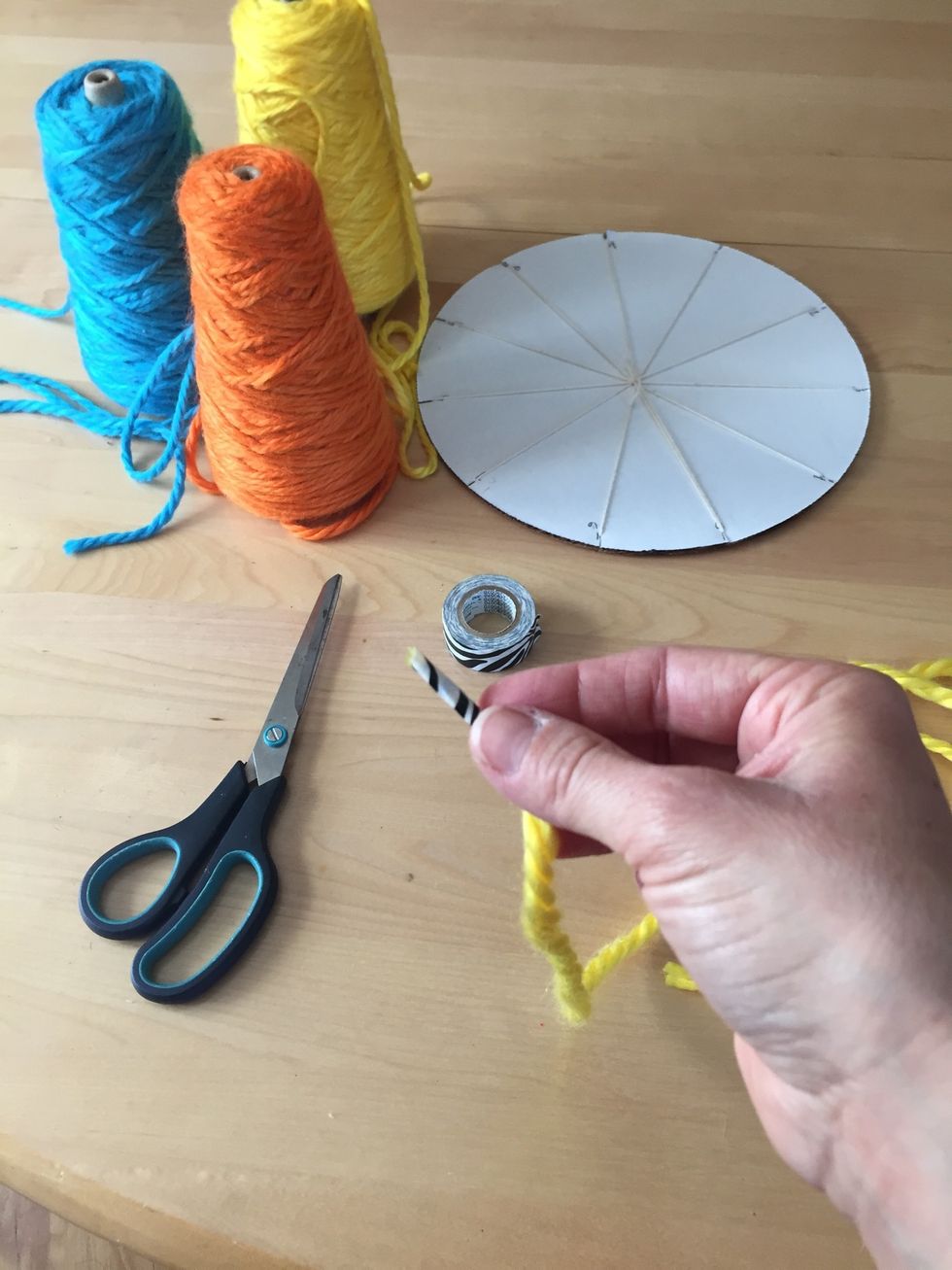 Put tape on the end of your yarn so it doesn't fray.