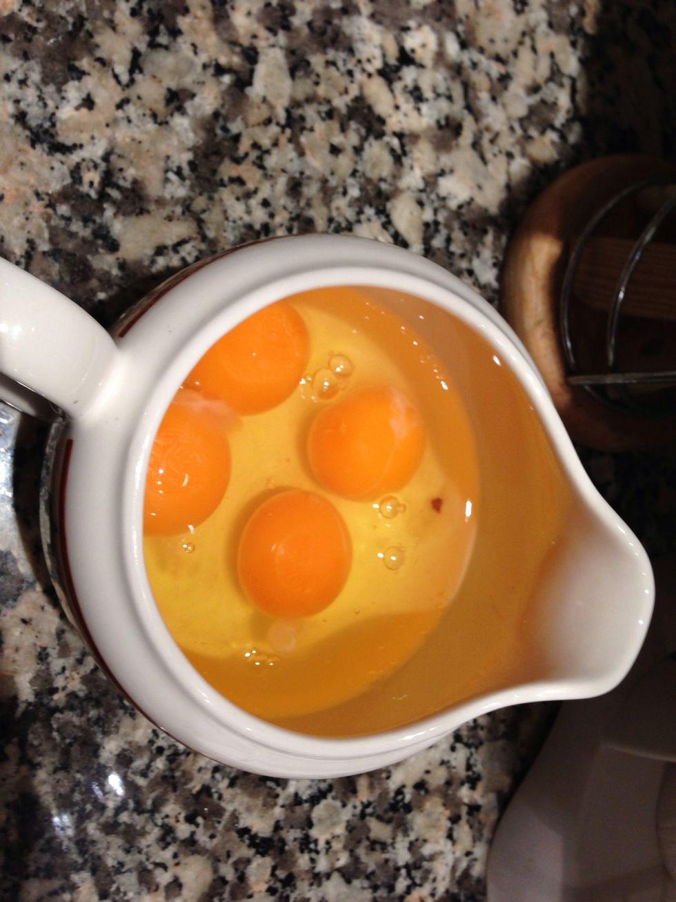 Put the 4 eggs in a small bowl