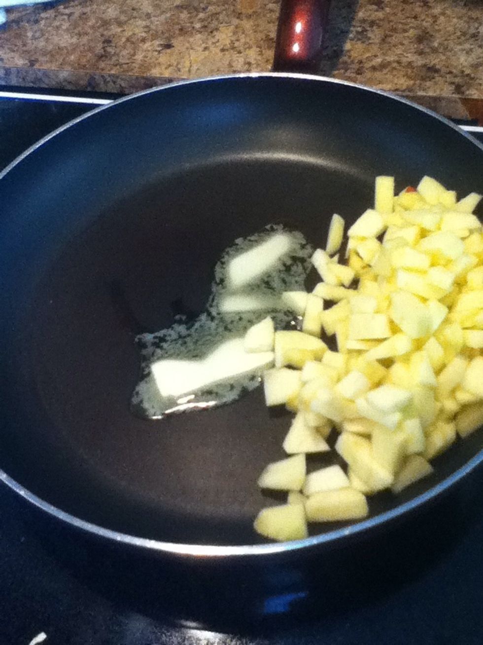 Put the apples in a pan and add some butter
