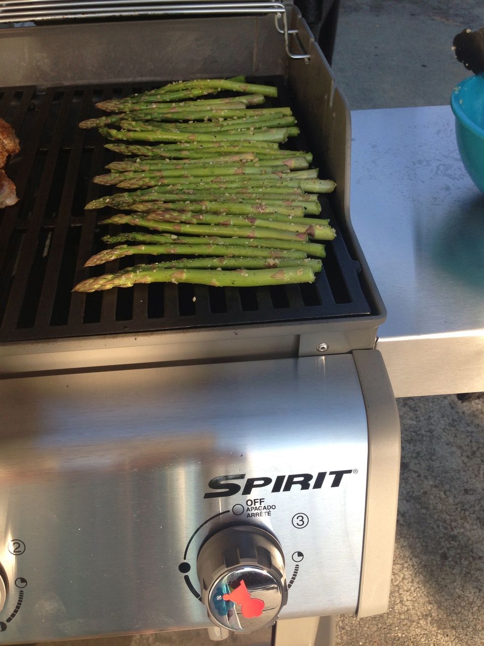 Put the asparagus on the grill. Cook for 8 minutes or until tender. Turn the asparagus after 4 minutes.