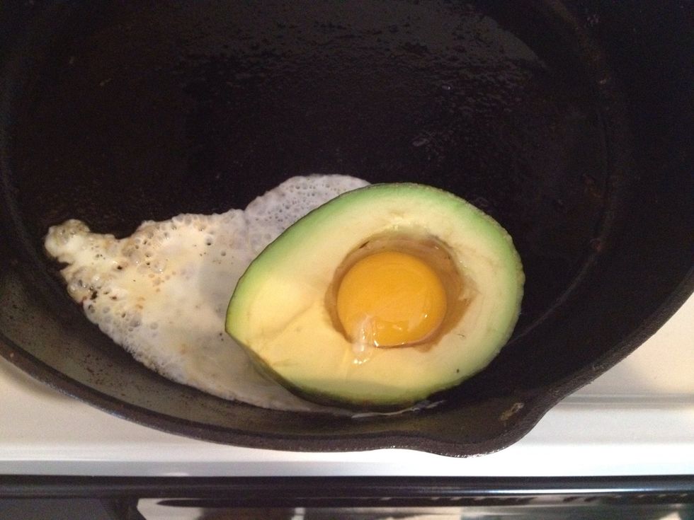 Put the avocado in the pan, the egg in the avocado and the pan back into the oven. Cook until the egg is how you like it. I like my eggs between med and hard. My oven took 13 minutes.