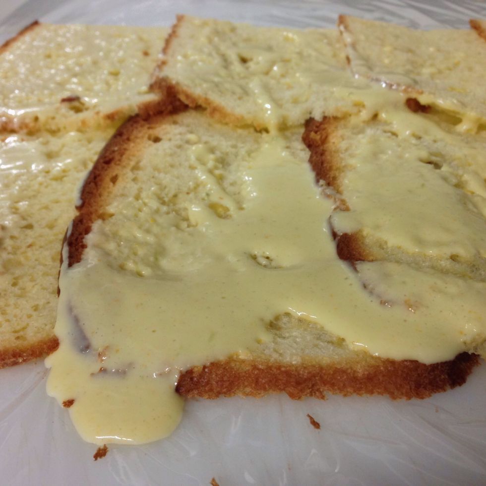 Put the b\u00e9chamel sauce on top of the bread to make it soft and easy to roll it
