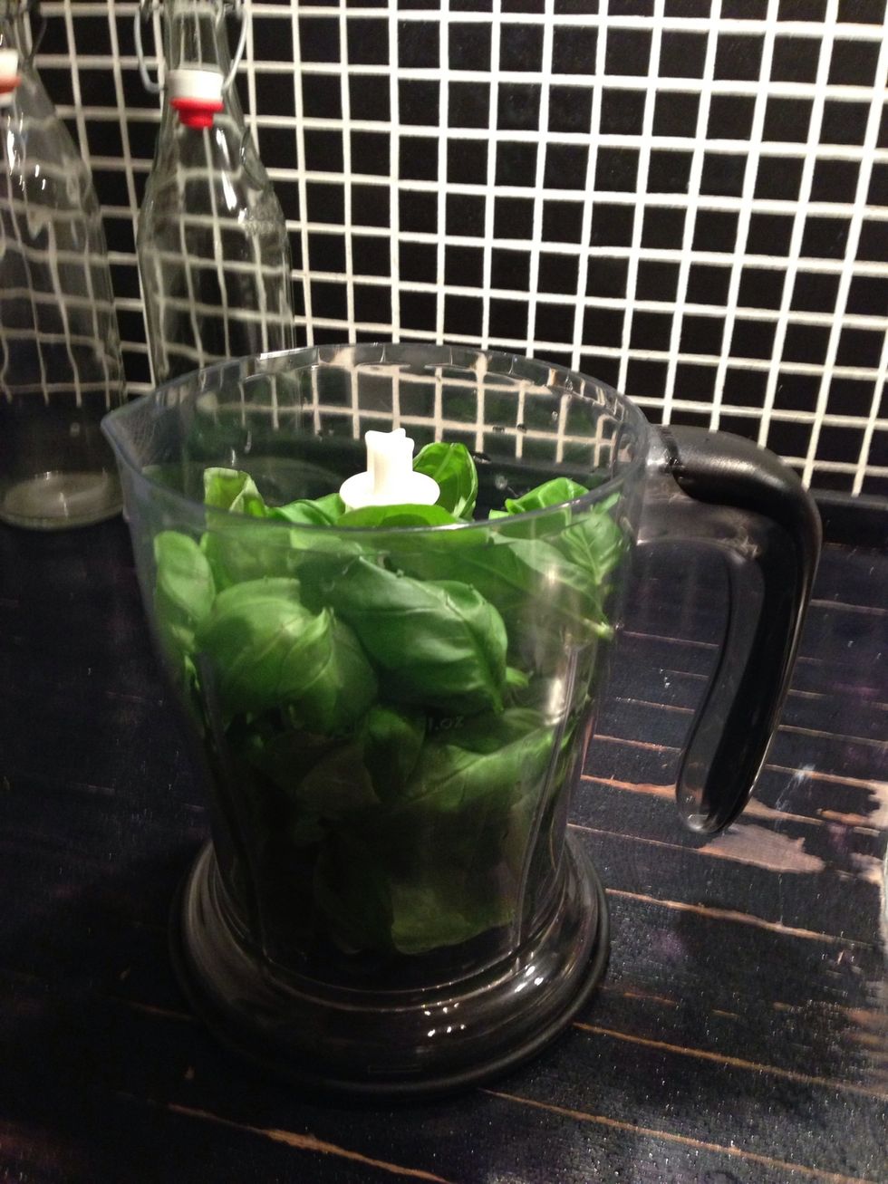 Put the basil in a blender (or similar)