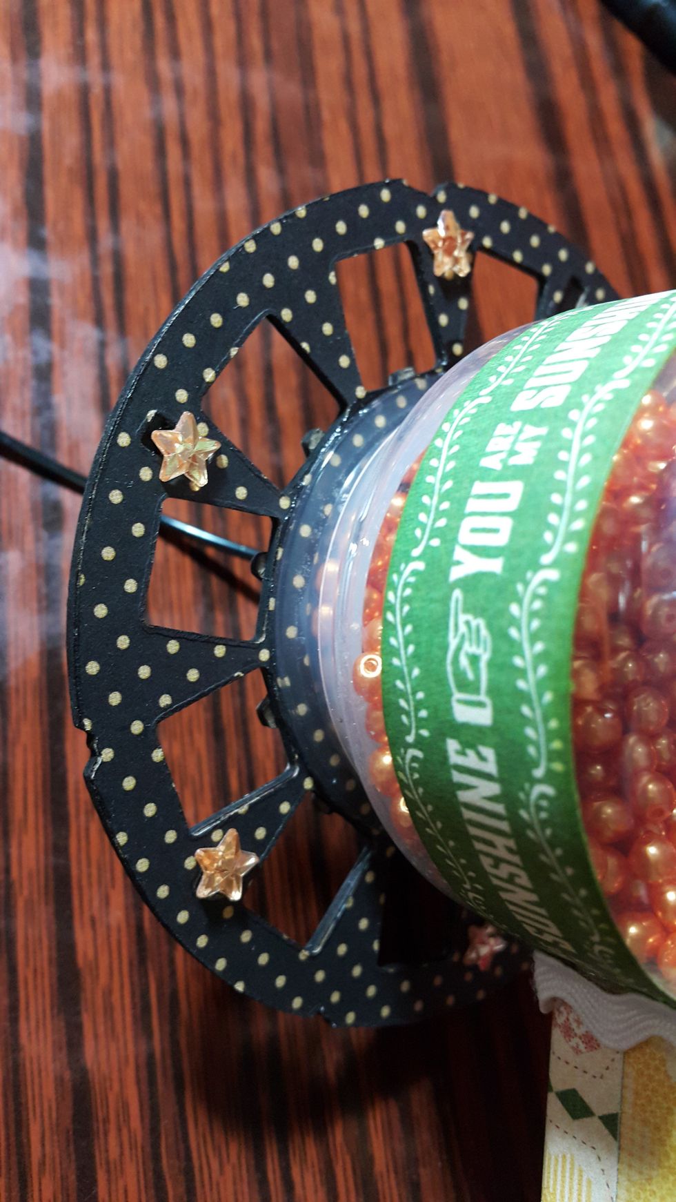 Put the beads and adhere the front of the fan with strong glue