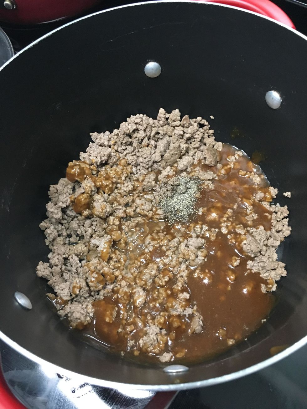 Put the beef, salt, and pepper into the gravy mix and stir.