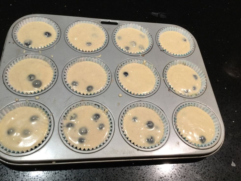 Put the blueberry muffins into the muffins cases