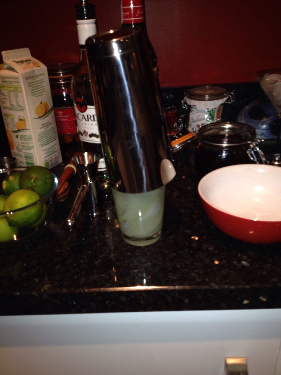 Put the Boston shaker on and give it a firm thwack to make a watertight seal. Then shake well for a long 10 count.