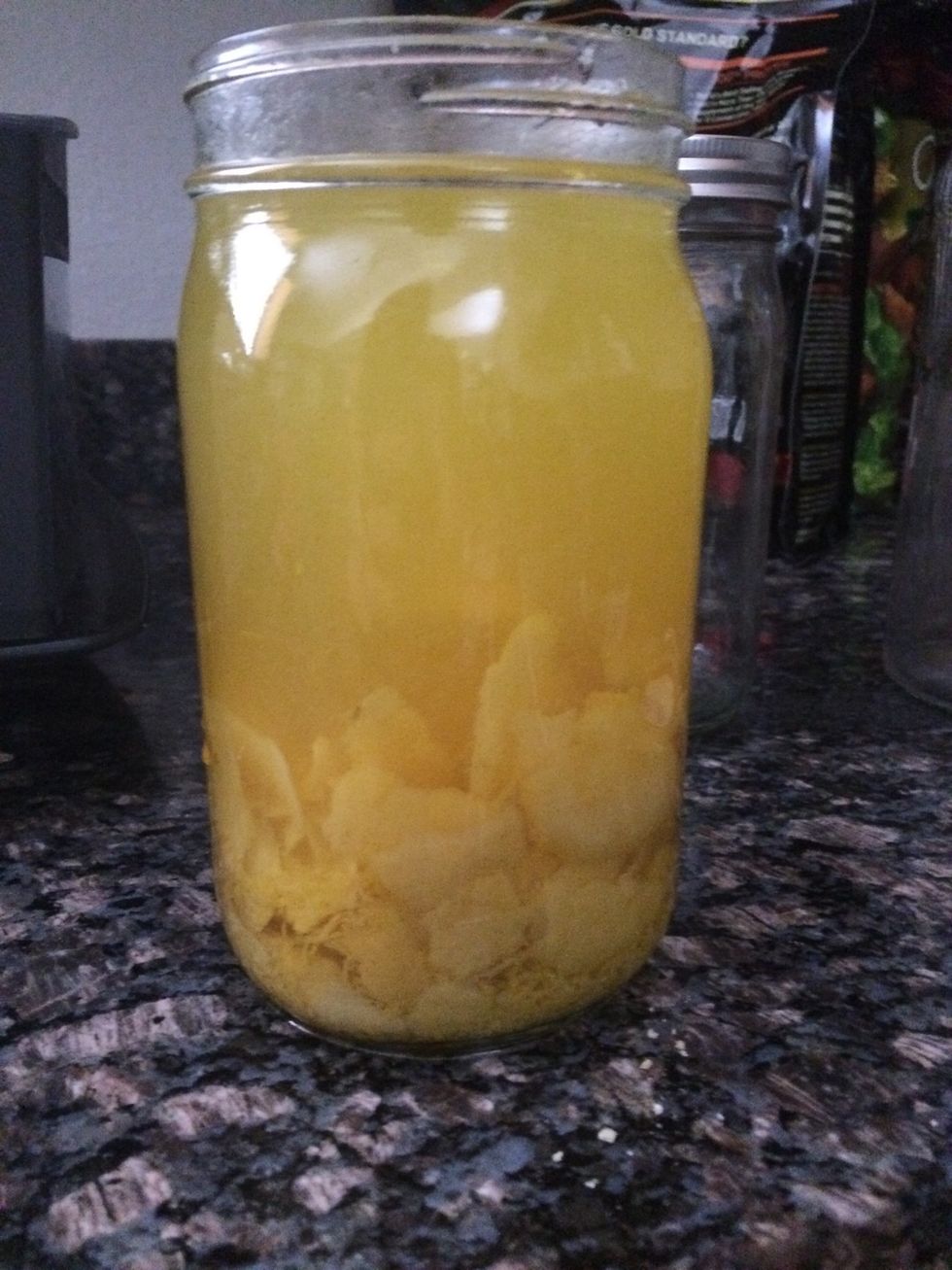 Put the bottle of 750ml vodka (140+proof) in a large glass jar with the lemons. I used Mason jars. Then put in a cool, dark dry place for as long as you can. (10-30 days)