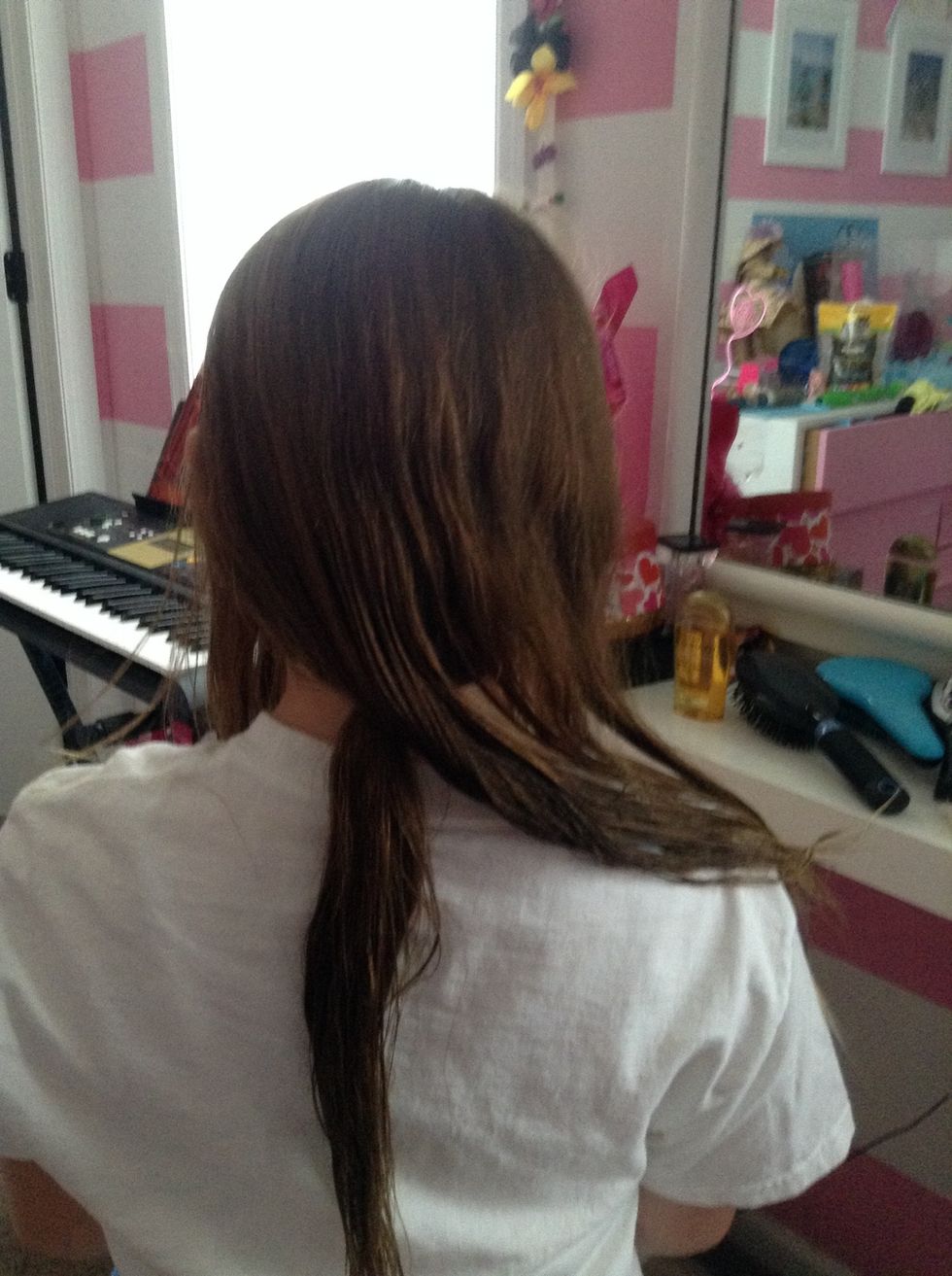 Put the bottom section in a pony and take out the messy bun. Still do not touch the front sections.