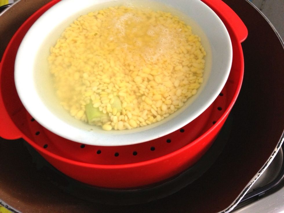 Put the bowl in a steamer, cover with the lid and steam it on medium heat for 30 mnts or until the mung dal is soft enough to make a paste