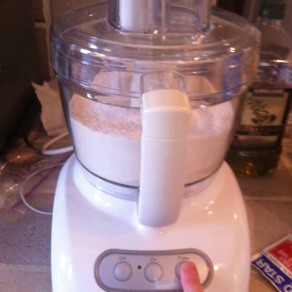 Put the bowl on the processor and pulse it a few times to combine the dry ingredients.