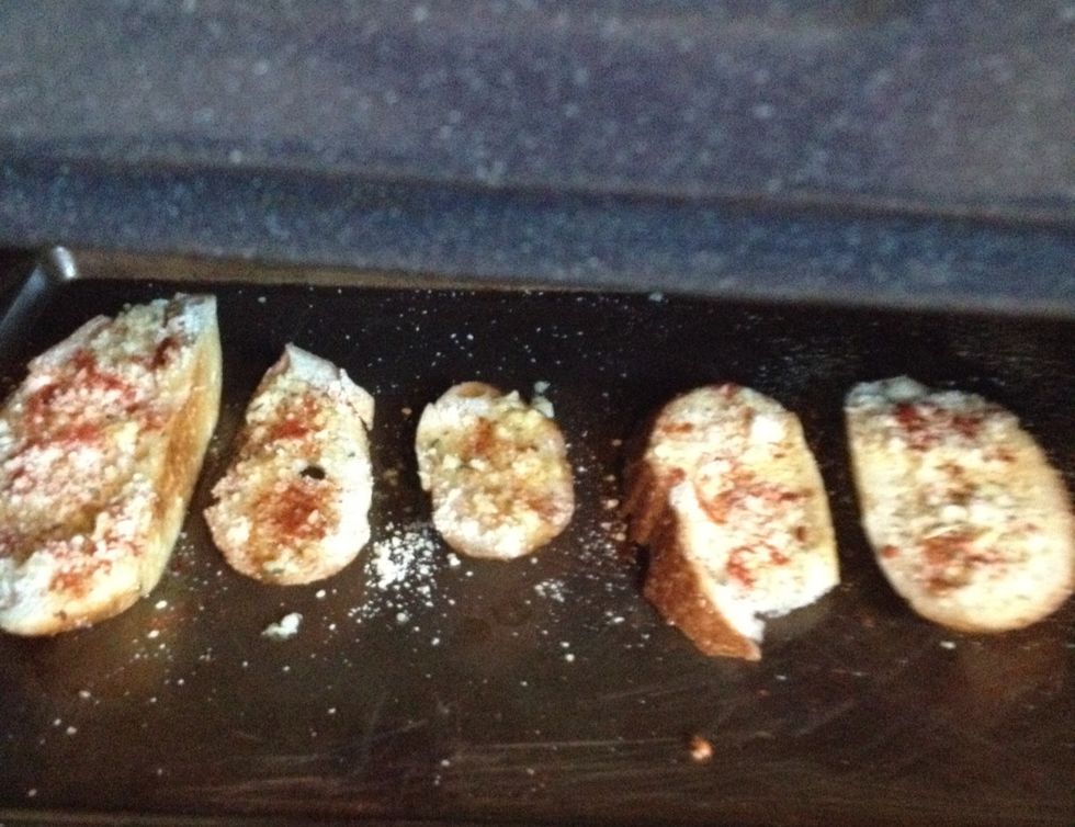 Put the bread in the oven for 10 to 15 minutes, until the cheese has melted and they are golden brown.