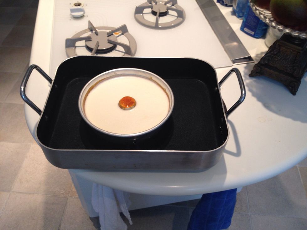 Put the bundt form pan inside the rectangle deep dish filled with water. Slowly!