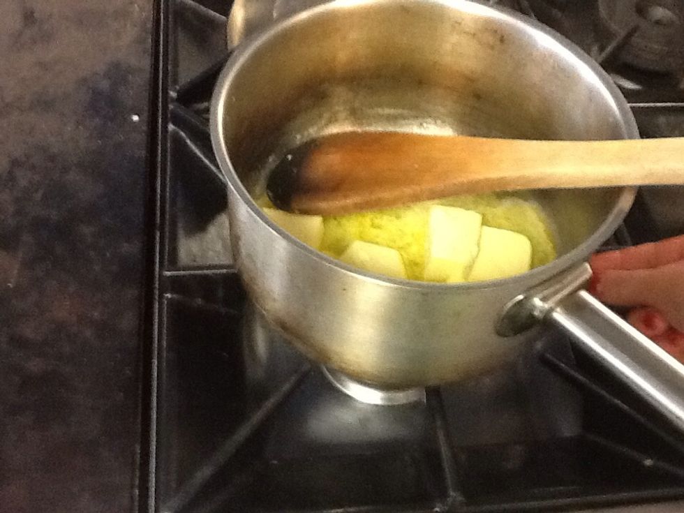 Put the butter and sugar in a saucepan and melt it gently on a low heat.