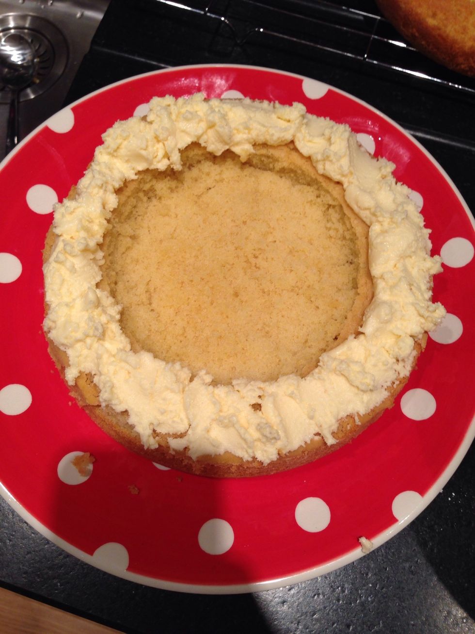 put the butter icing around the edge of the hole in the middle