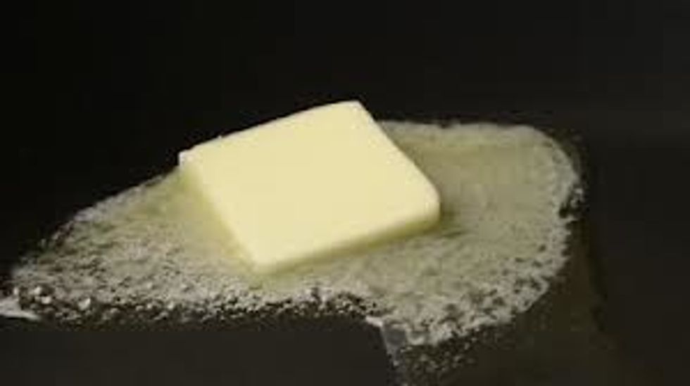 PUT THE BUTTER IN PAN LET THAT MELT THEN PUT BREAD IN THE PAN.