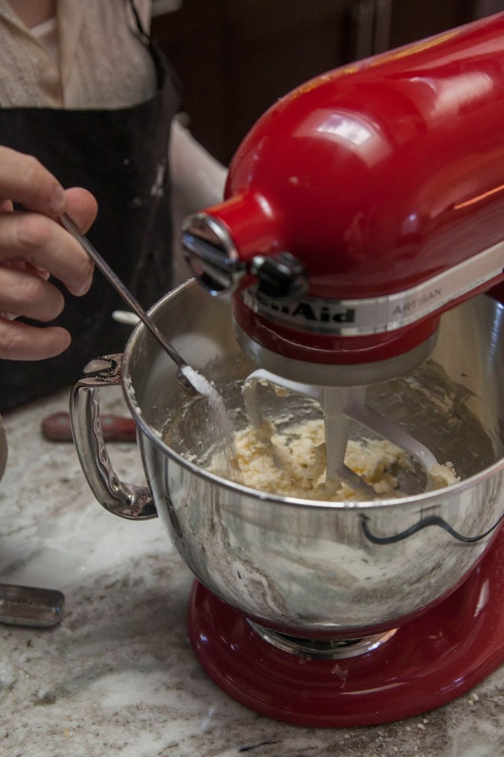 Put the butter into a stand mixer with the paddle attachment, turn it to low and blend it until the butter is creamy. When it's creamy add in the Parmesan cheese, salt...