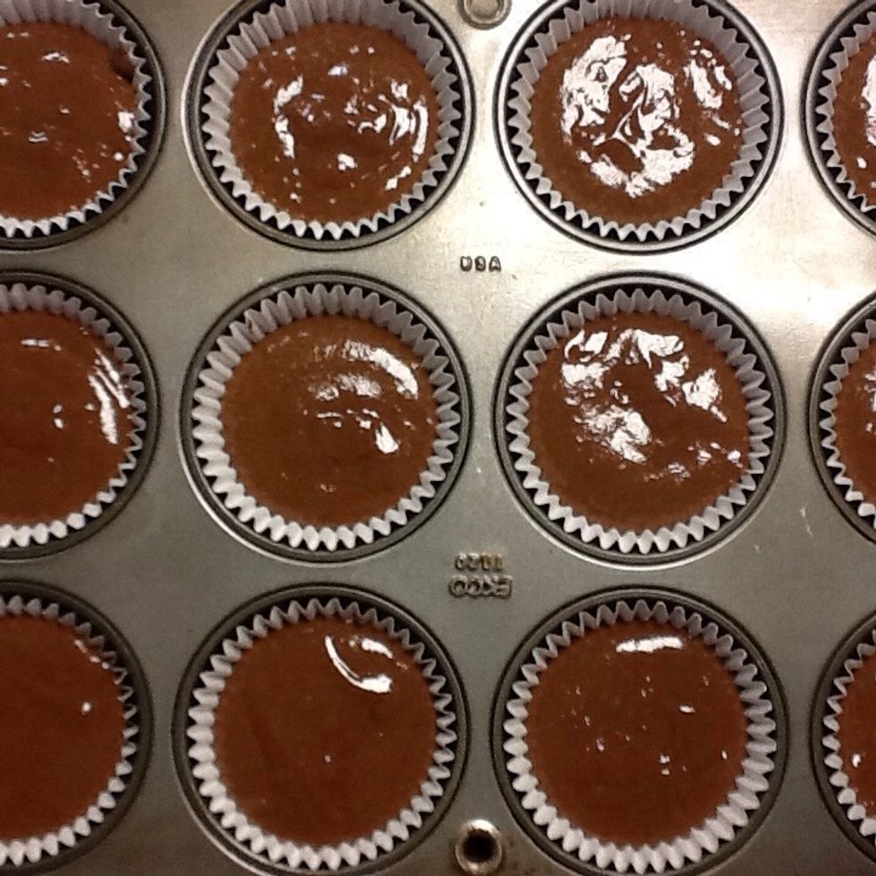 Put the cake in the cups. Pre heat the oven to 350