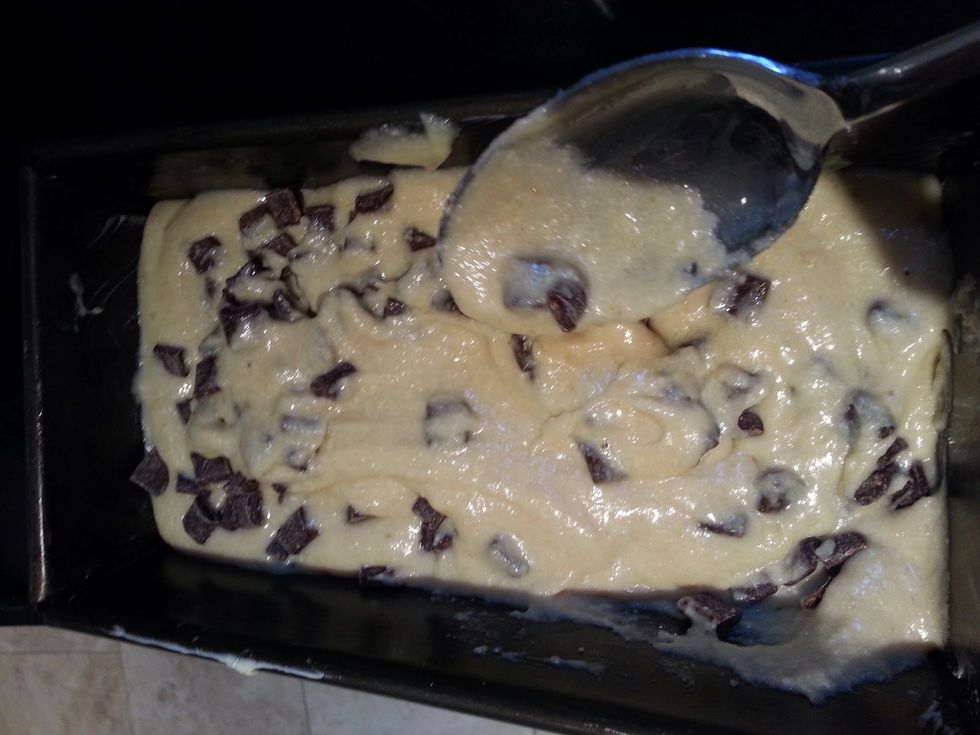 Put the cake mixture into a baking tin, now you can mix the chocolate chips in! I also put a few walnuts in but that's totally up to you.