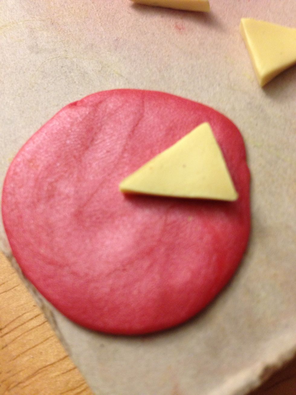 Put the cake slice on top of the icing slice to make sure the icing is the same size as the cake. You'll always need one less slice of icing than cake. So 2 icing triangles with three cake layers.