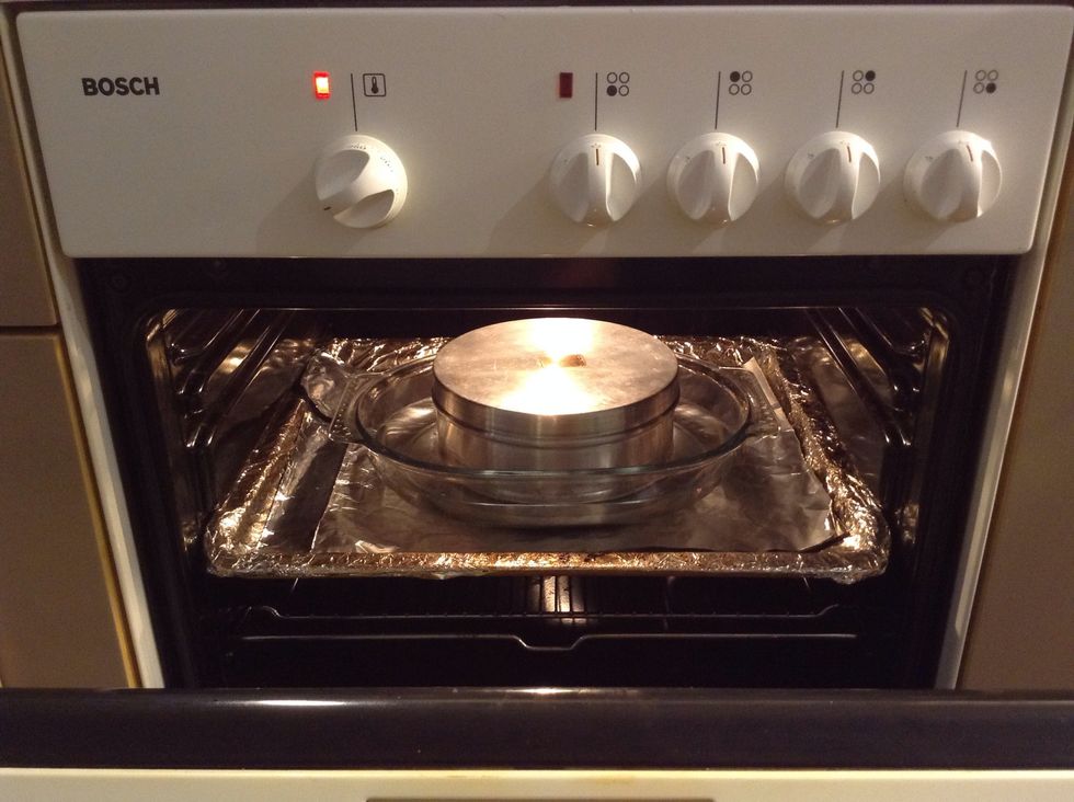 Put the can inside an oven pan and fill the pan with water at room temperature until about halfway up the sides of the can. Cook it for about 50 minutes to 1 hour
