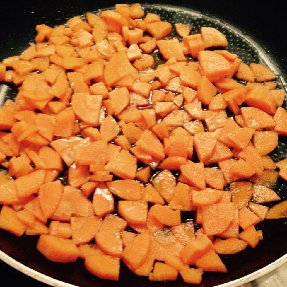 Put the carrots in a pan with some olive oil and a splash of water