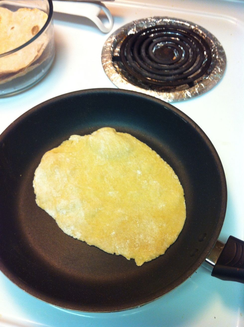 Put the chappati in the pan and turn both sides and the chappati is ready