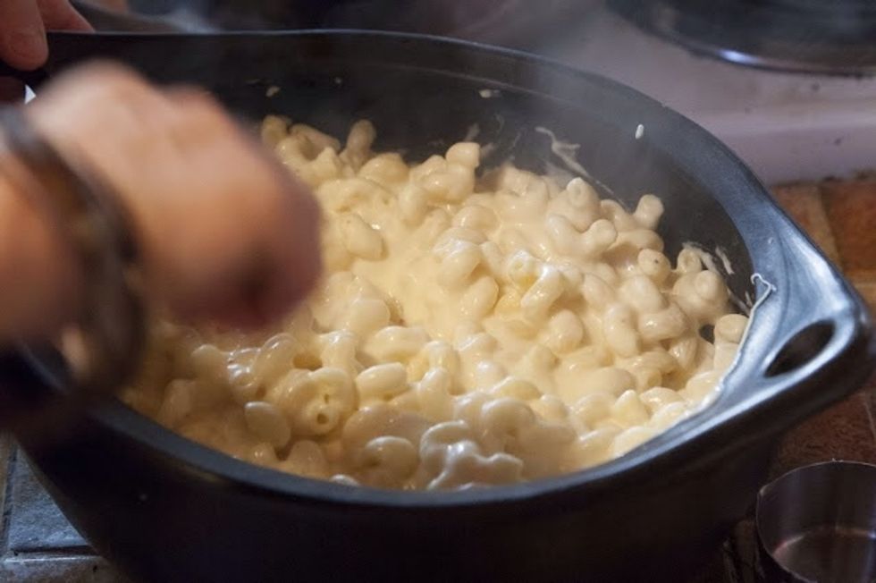 Put the cheese and pasta mixture into the greased baking dish. Pop it into the oven to bake for about 20 minutes . It should be hot and bubbly when done.