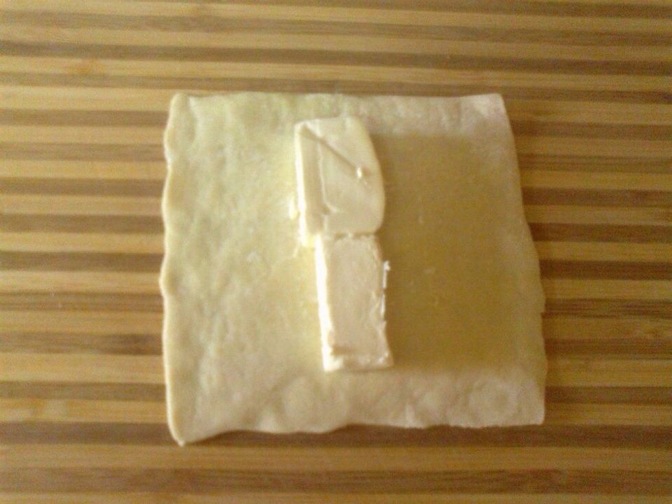 Put the cheese on the puff pastry square