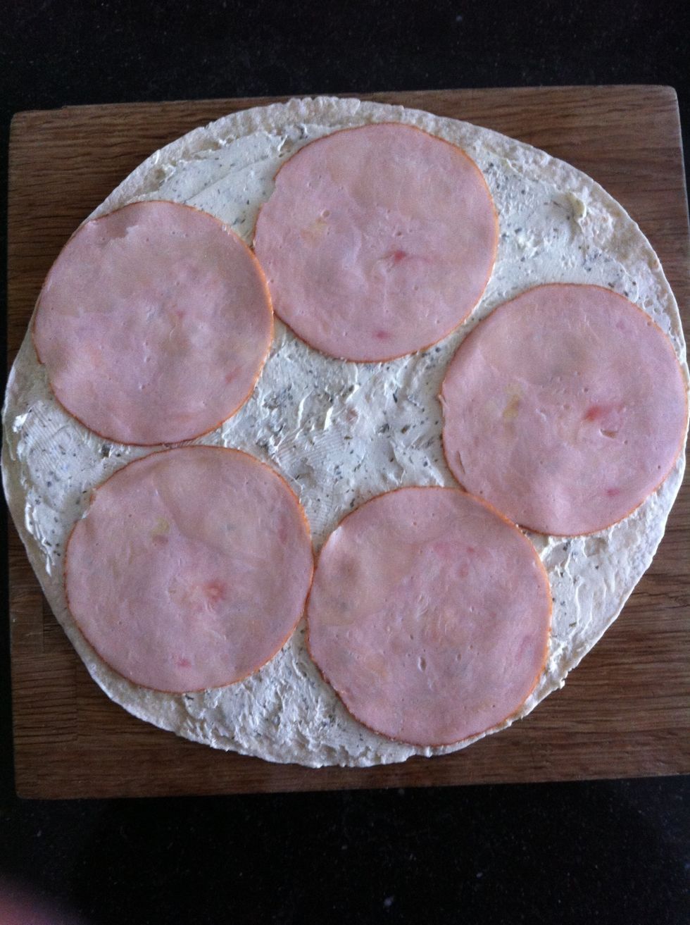 Put the chicken breast on the wrap. The wrap doesn't have to be completely covered. For this step you could as well use ham or salmon.