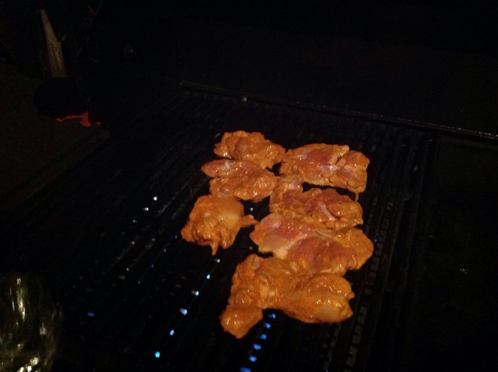 Put the chicken on the barbecue. It needs to cook for around 15 minutes.