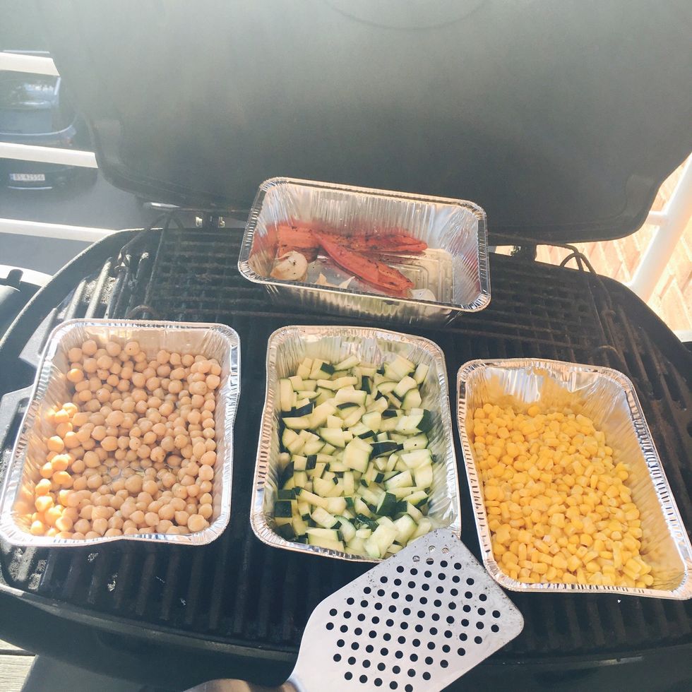 Put the chili back together with the garlic. Let everything heat/roast on the grill for 20-25 mins. (Keep an eye on it and toss around with the spatula once in a while).
