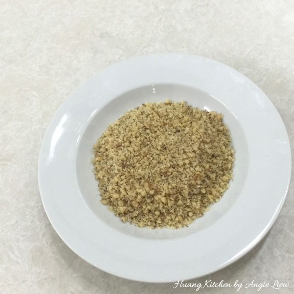 Put the chopped walnuts in a shallow bowl and set aside.