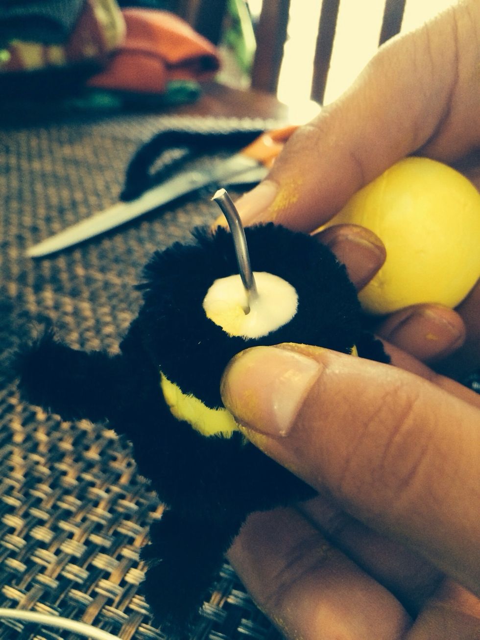 Put the circle that you made in step 27 around the wire.