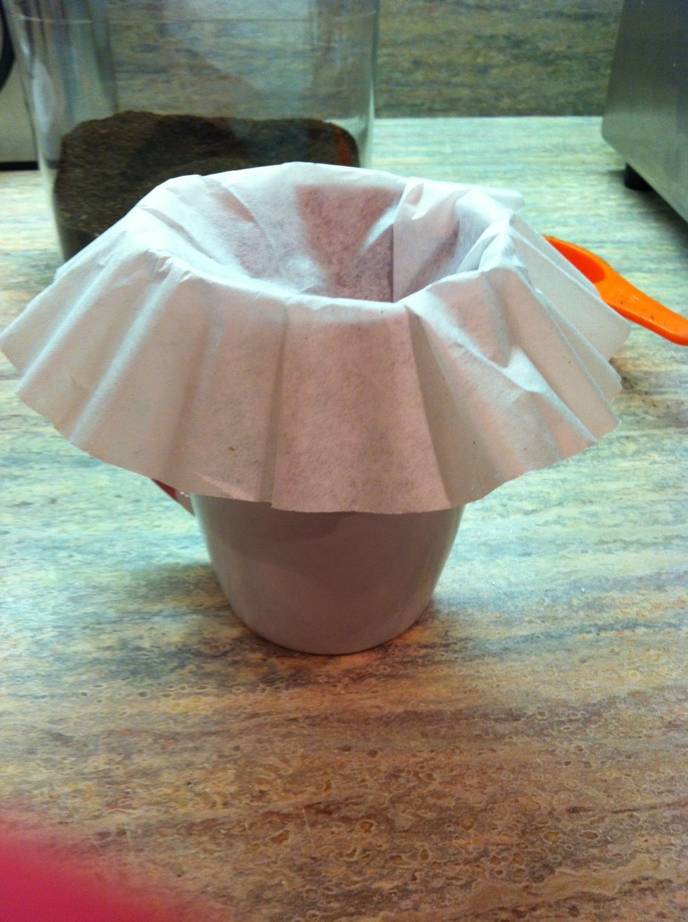Put the coffee filter over the empty coffee cup