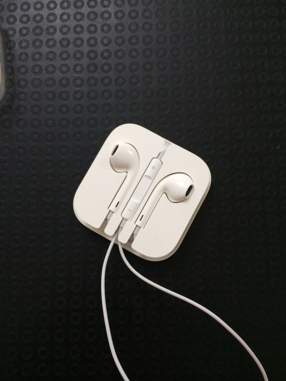 Put the controls in its socket. Keep the controls on top of the other loose cable. From here, rotate the remaining cables counter-clockwise until its all neatly packed.