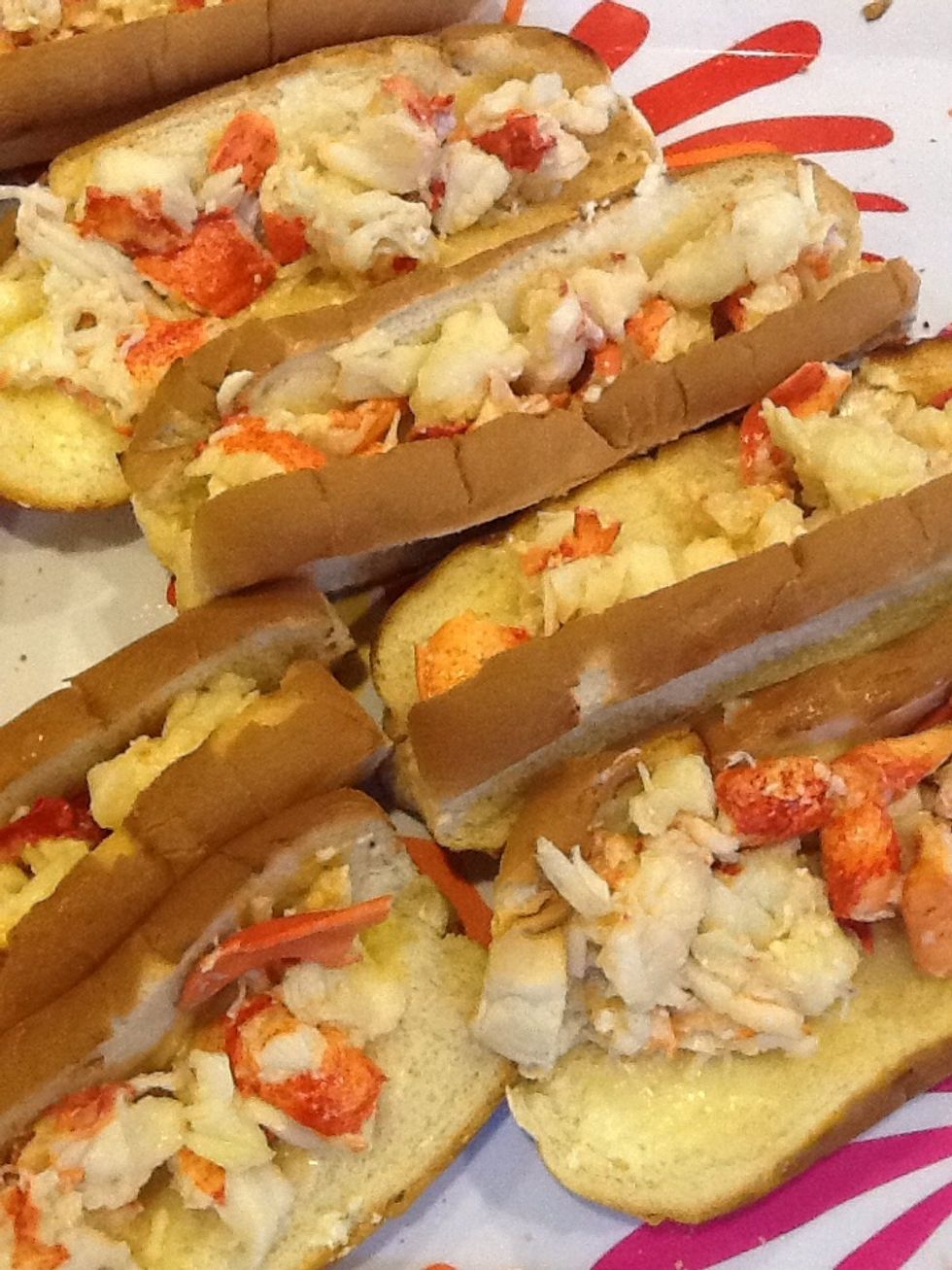Put the cooked Lobster meat into the toasted hot dog buns.