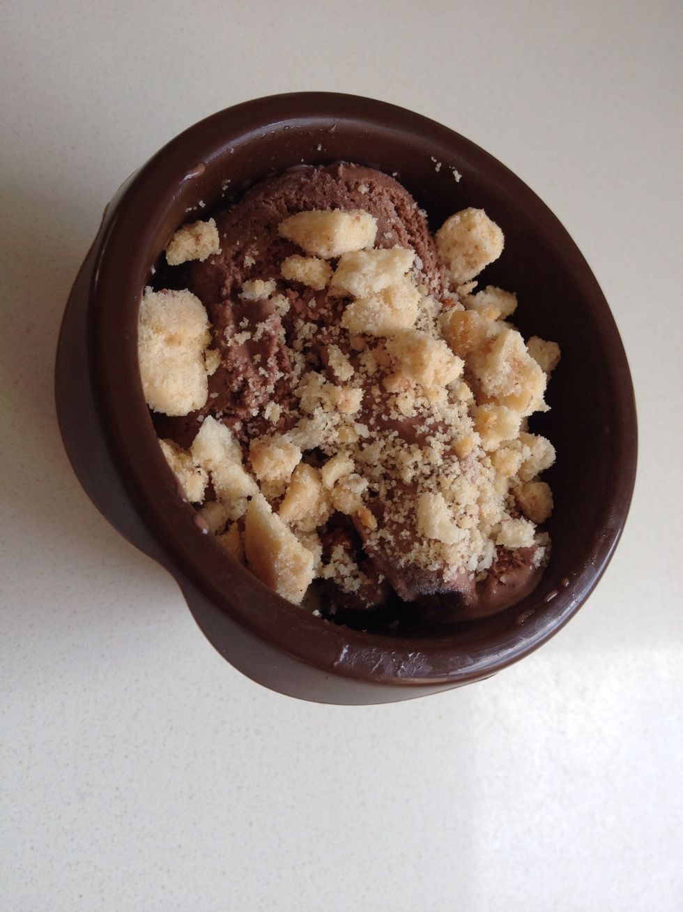 Put the cookies pieces on the ice cream scoop