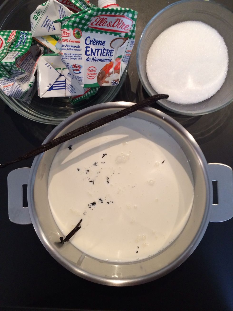 Put the cream in the cooking pot. Add the vanilla beans inside the pod...put the pod on the cream it will b strained later.