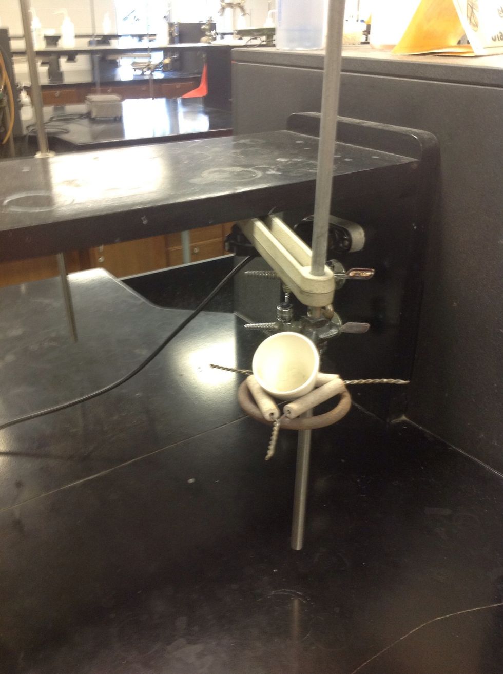 Put the crucible on the clay triangle.