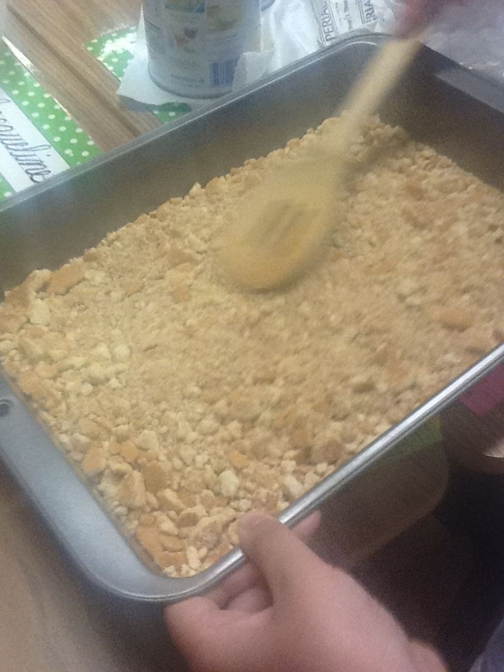 Put the crushed vanilla wafers in a pan
