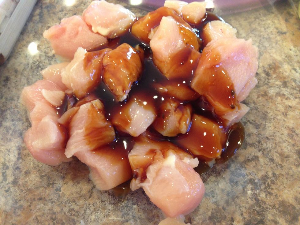 Put the cubed chicken on a large bowl and add Teriyaki sauce. You can use 1/2 cup sauce all the way to 1 cup depending on what you like.