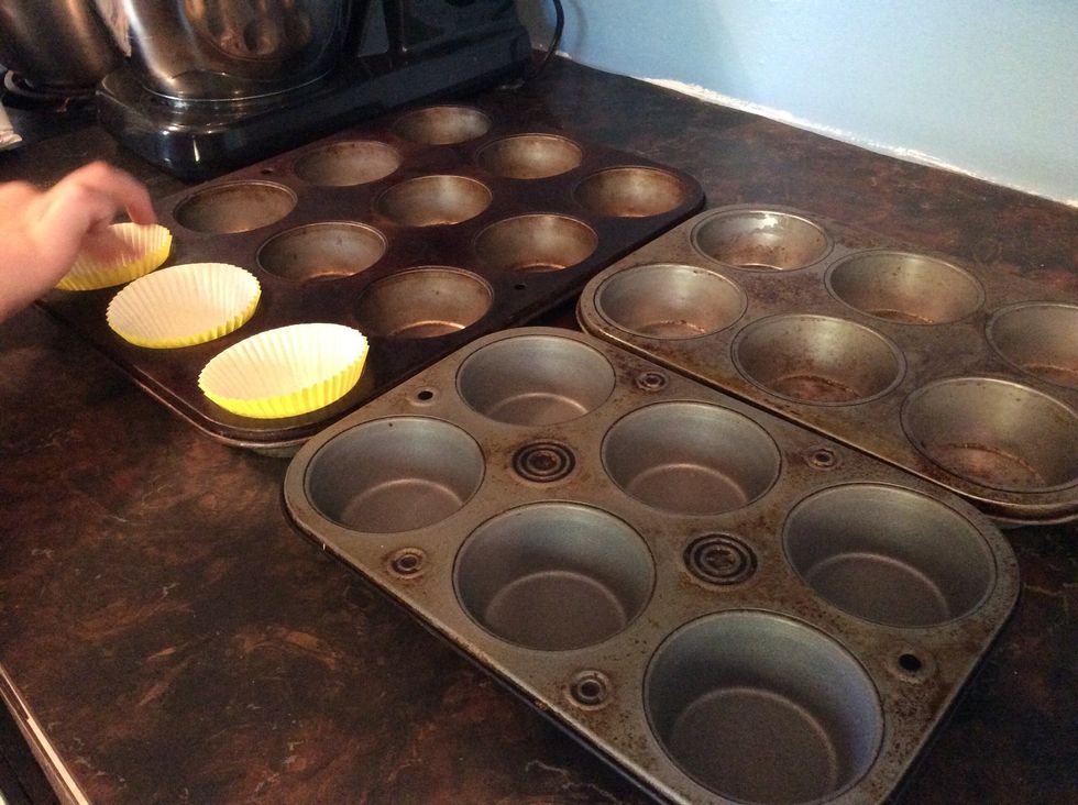 Put the cupcake liners in the cupcake pans.