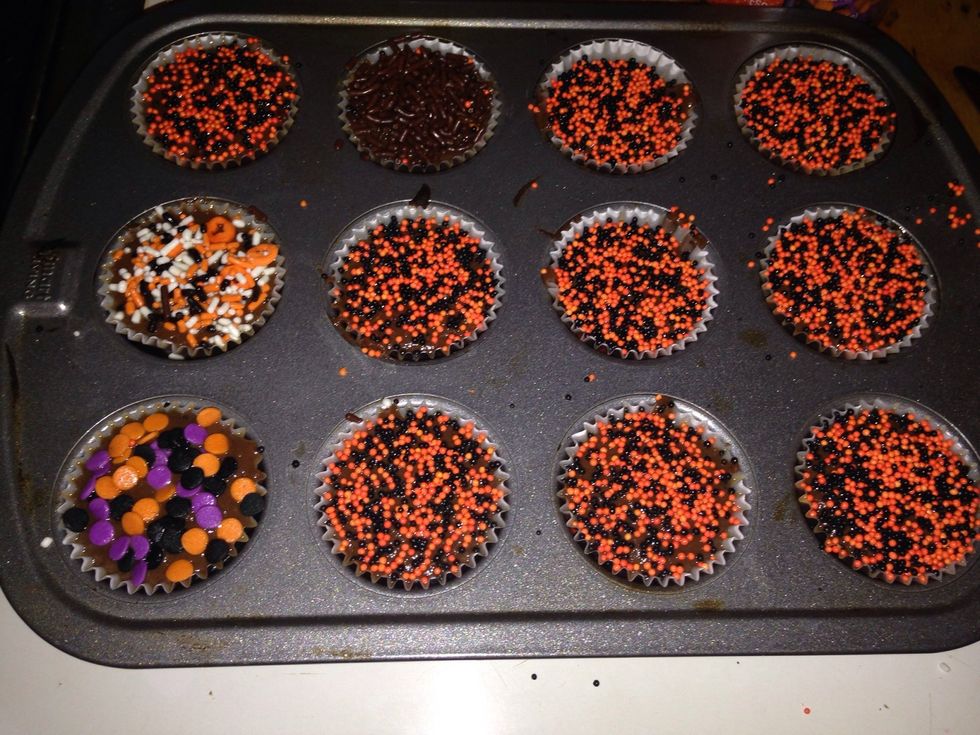 Put the cups in the mini muffin pan. Fill the cups...but be careful that shit it really hot! You can leave them plane or put sprinkles on top