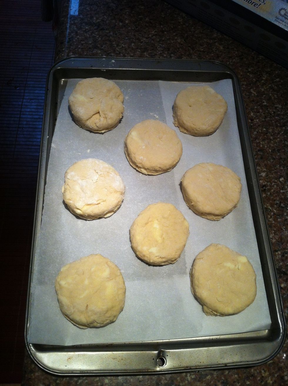 Put the cut biscuits on a cookie sheet. I like my biscuits to rise a lot during baking, so I put them close together on a small sheet. For shorter biscuits, leave more space between them.