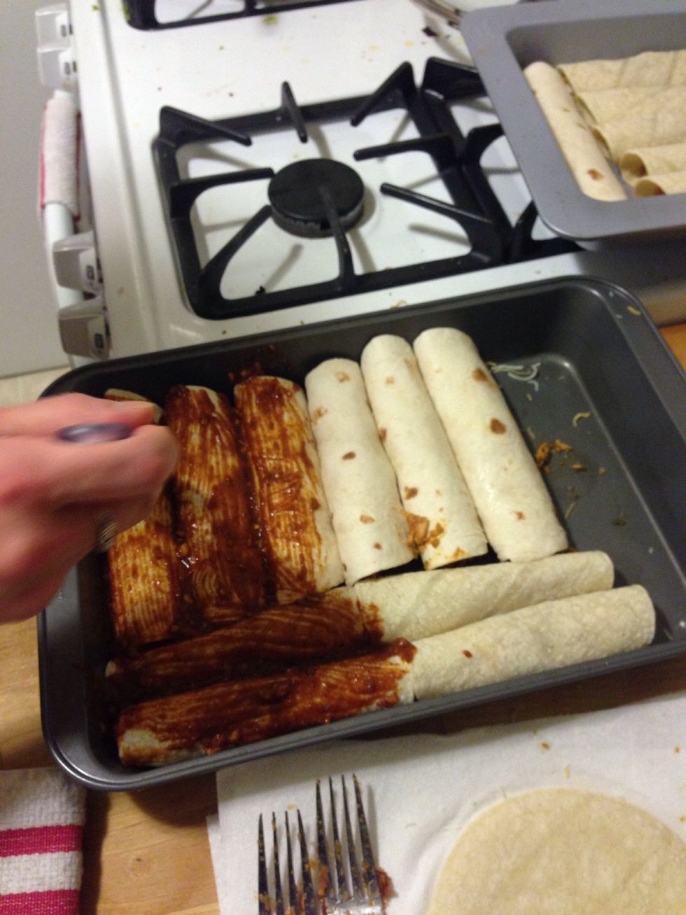 Put the desired amount of sauce of the enchiladas. The flour tortillas tasted slightly better with the sauce than the corn ones, but they both tasted amazing. ^_^